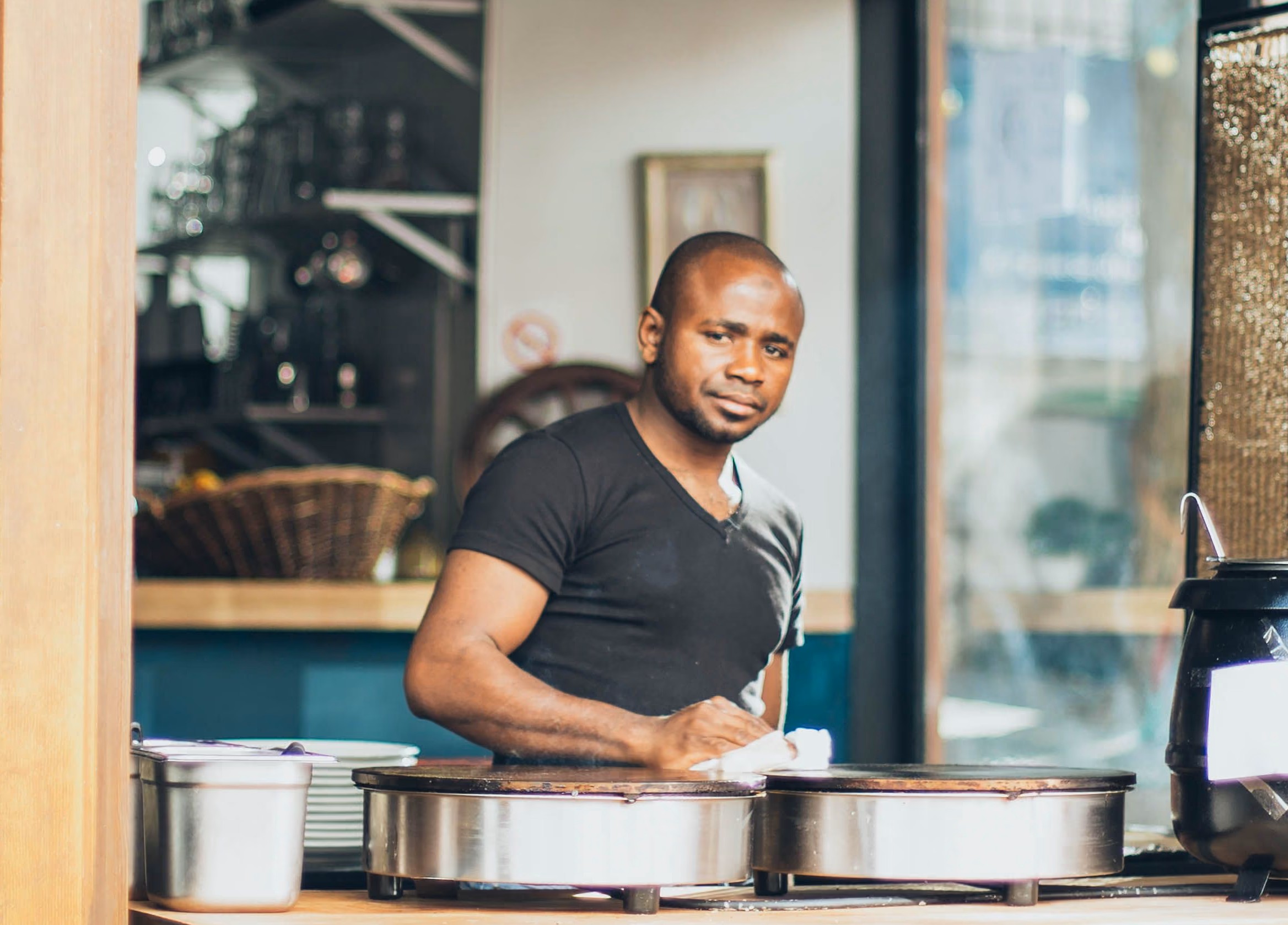 Small business owner in front of his Miami storefront