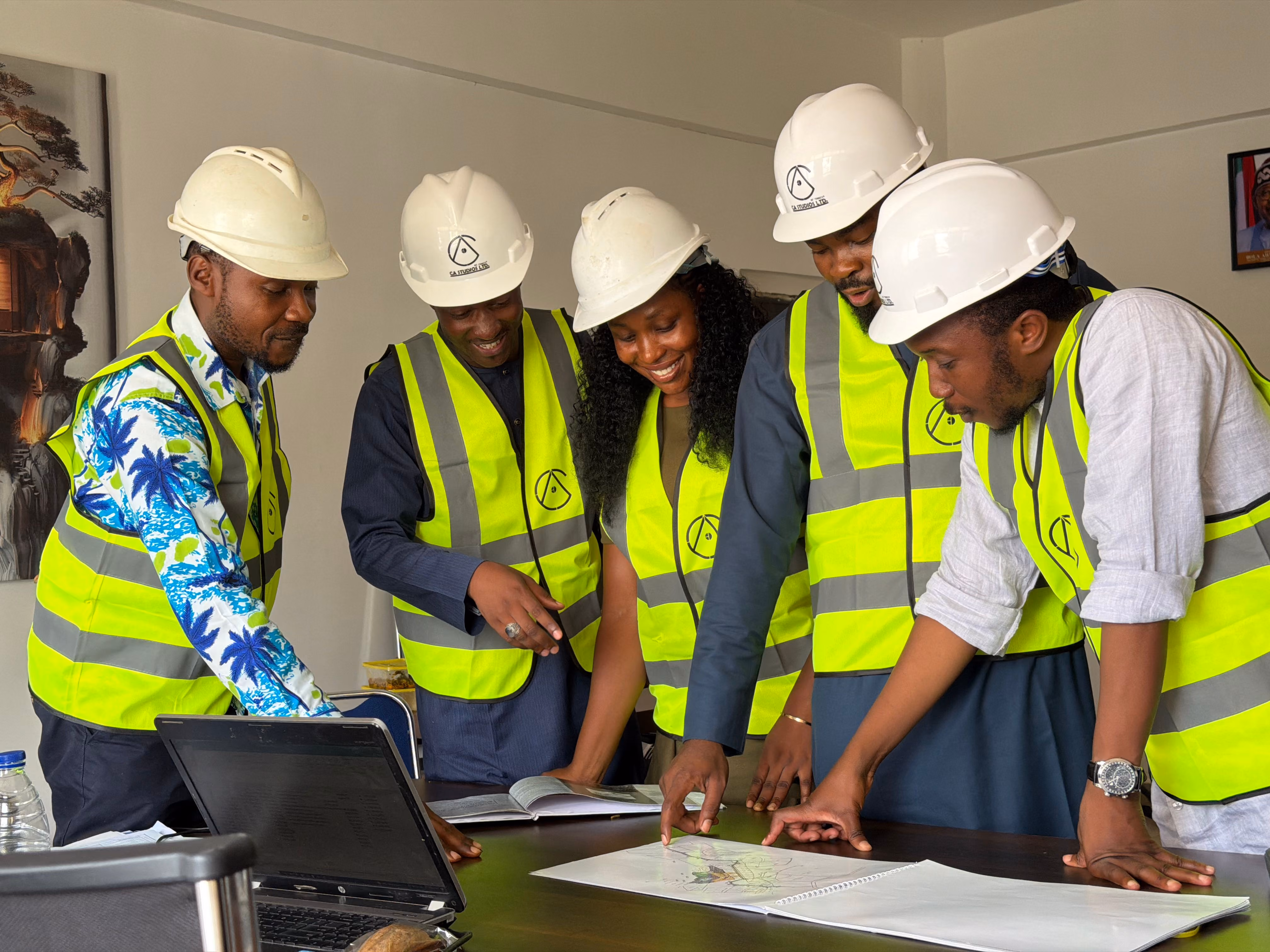 Construction crew reviewing plans on a Miami waterfront job site